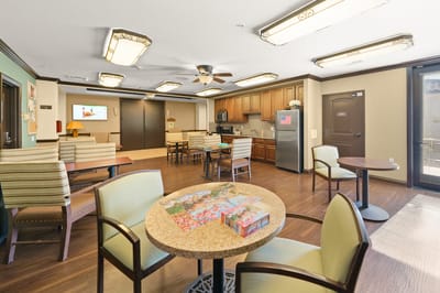 Bright common area with tables and seating