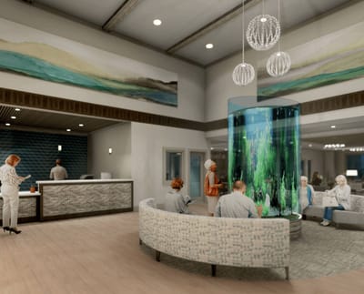 Bright common area with residents and staff interacting