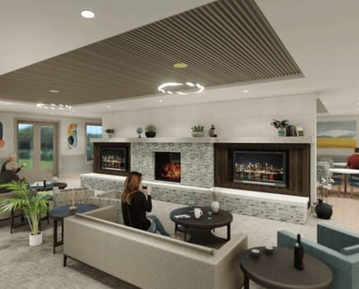Residents enjoying a cozy lounge area with a fireplace