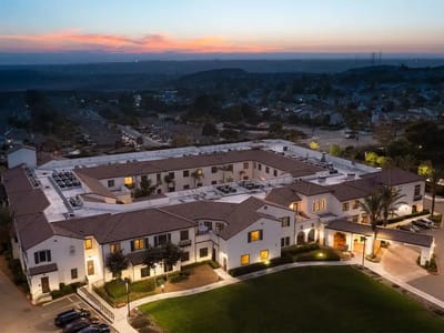 Aerial view of a senior living facility at sunset
