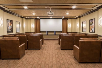 Cozy movie theater room with comfortable seating