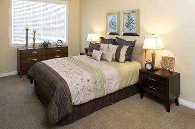 A cozy private resident room with a bed and decor