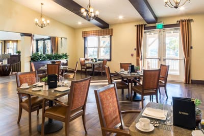Elegant dining room with set tables and natural light