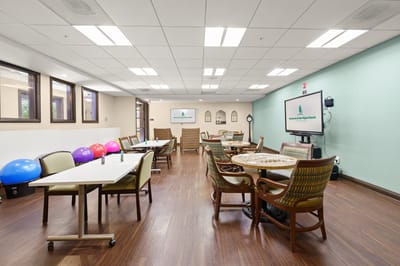 Activity room with tables and exercise equipment