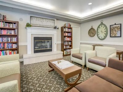 Common area with seating and bookshelves.
