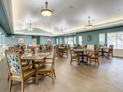 Bright dining area with tables and chairs