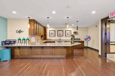 Bright and inviting common area with coffee station