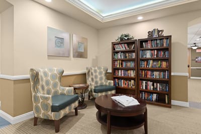Cozy reading nook with bookshelves and seating