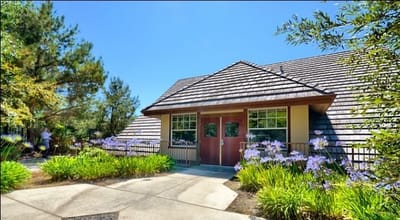 Front entrance of Westmont of Brentwood with flowers