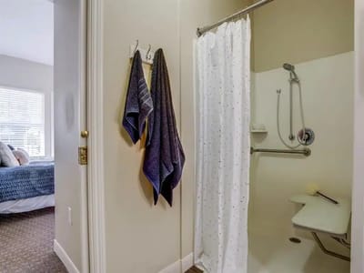 A view of a bathroom with towels and a shower