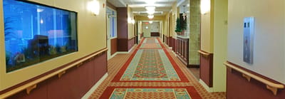 Interior hallway of a nursing home with artwork