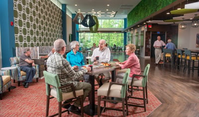 Residents enjoying refreshments in a common area