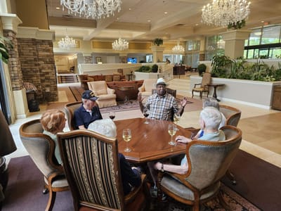 Residents enjoying a conversation in a common area.