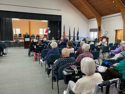 Residents attending an event in a community room