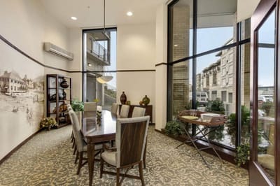 Bright, inviting common area with a dining table