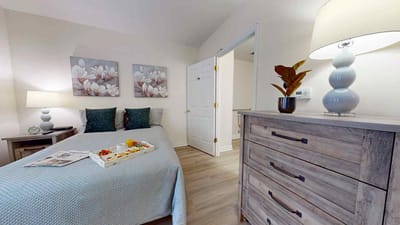 Cozy bedroom setup with decorative elements.