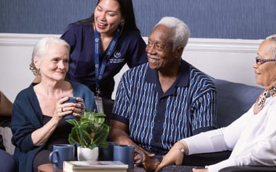 Residents enjoying time together with staff.