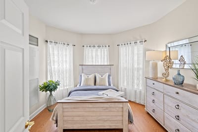 A cozy resident bedroom with light decor