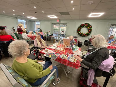Residents engaged in an arts and crafts activity indoors