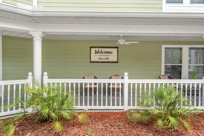 Welcoming porch area with chairs and plants