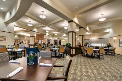 Spacious dining area with tables and decor