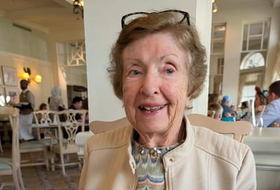 Resident enjoying time in a dining area