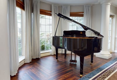 Grand piano in a well-lit interior space