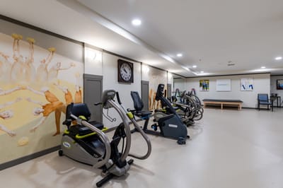 Interior of a fitness area with exercise equipment.