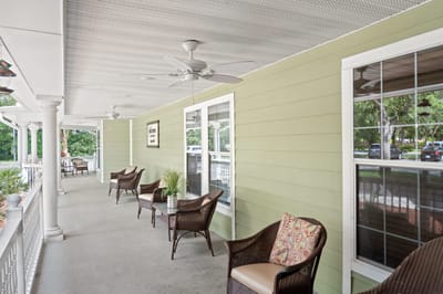 Covered porch with seating and plants