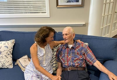 A resident and visitor enjoying time together.