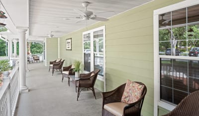 Outdoor seating area with chairs and plants