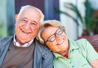 A happy elderly couple smiling together