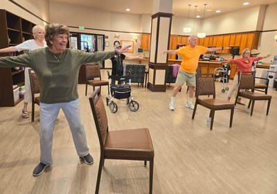 Residents participating in an exercise activity indoors.