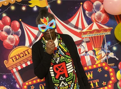 Resident enjoying a festive event with a mask