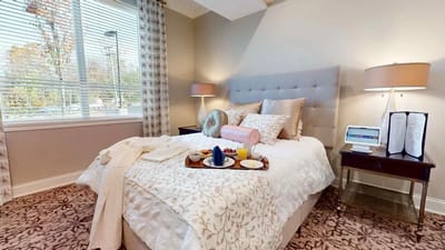 Comfortable bedroom with breakfast tray