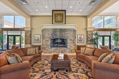 Cozy lounge area with a fireplace and seating.