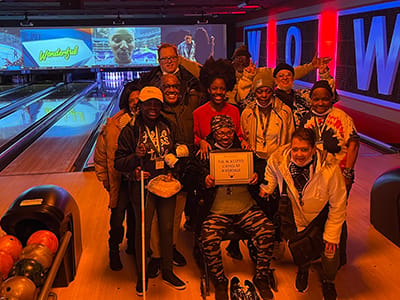 Residents participating in a bowling activity