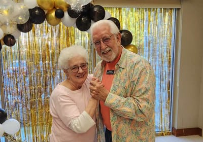 Celebration with two smiling seniors at an event