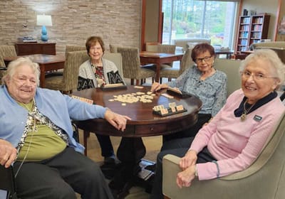 Four residents enjoying a game together.