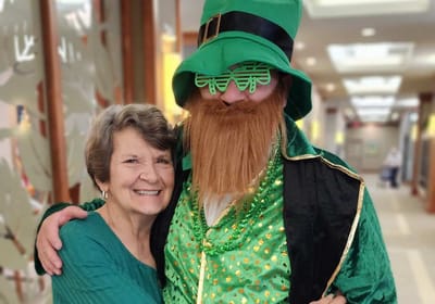 Resident enjoying time with a staff member in costume.