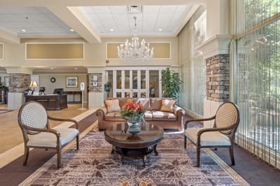 Inviting lounge area with comfortable seating and flowers.