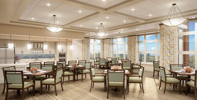 Bright dining room setup with tables and chairs.