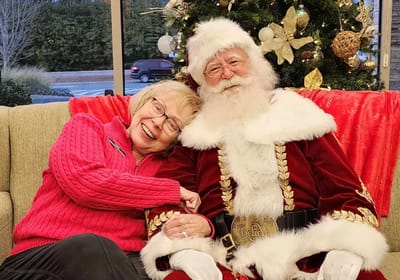 Resident enjoying Christmas with Santa Claus