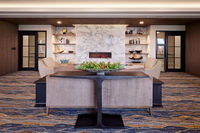 Modern common area with cozy seating and fireplace