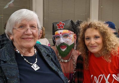 Three residents enjoying a festive event together.