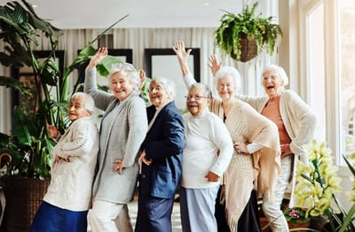 Group of joyful senior women in a common area