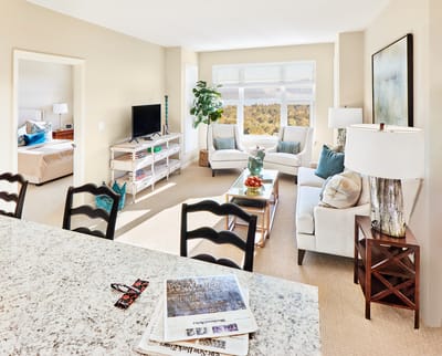 Bright and inviting living area of a resident's room.