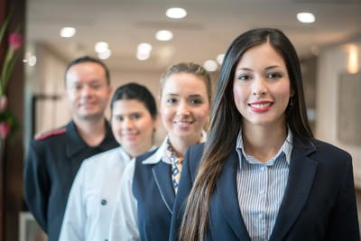 Group of staff members smiling in a common area