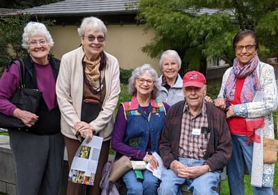 Group of residents enjoying an outdoor gathering.