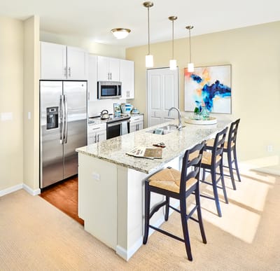 Bright and modern kitchen area with seating.